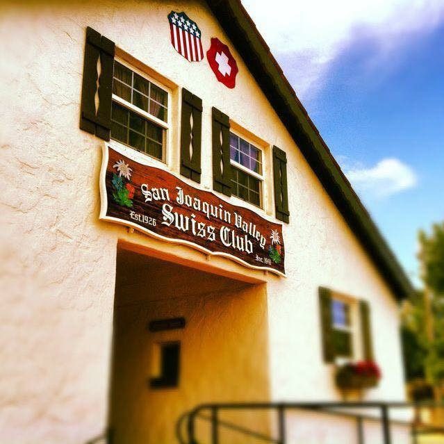 The painted sign over the hall door reading San Joaquin Valley Swiss Club, Est. 1926, Inc. 1941